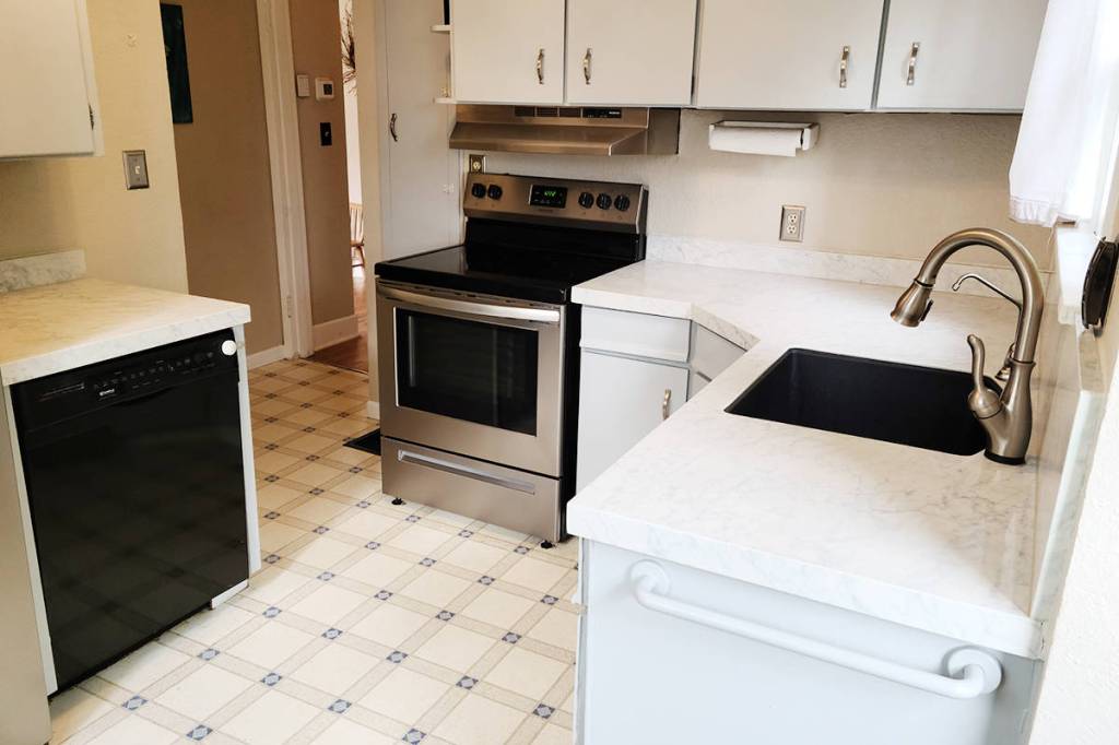 Chris Shin and Nicole Appell have undertaken many home renovations over the past few years, but Nicole says the new kitchen countertops from Granite Transformations are her favorite. Granite Transformations photo.