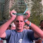 Michael Brian Protzman holds a trophy on Nov. 1. Photo via Protzman's Negative48 Telegram channel