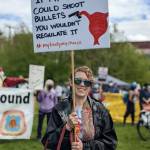 A woman smiles while holding a sign at the Cal Anderson Park reproductive rights protest on May 14, 2022. Hannah Saunders/Sound Publishing