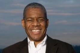 Michael Pinckney holds a platter of cookies. Courtesy of Pinckney Cookie Cafe.