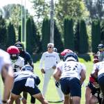 Pete Carroll looks over the punt team at the beginning of practice. (Maria Dorsten Photography)