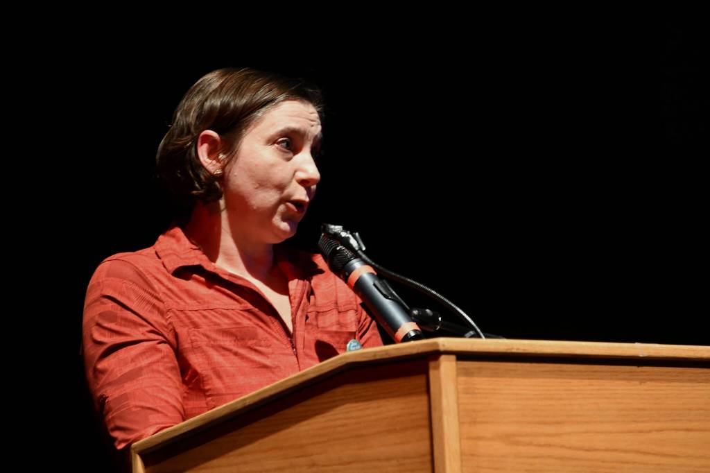Julianna Dauble of the Renton Education Association addresses the crowd at the School Funding Crisis Eastside Town Hall on Jan. 8 at Sammamish High School in Bellevue. Andy Nystrom/ staff photo