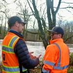 King County Flood Patrol members Thomas Bannister (left) and Seth Ballhorn on their patrol route, Dec. 9, 2025. (Grace Gorenflo/Sound Publishing)